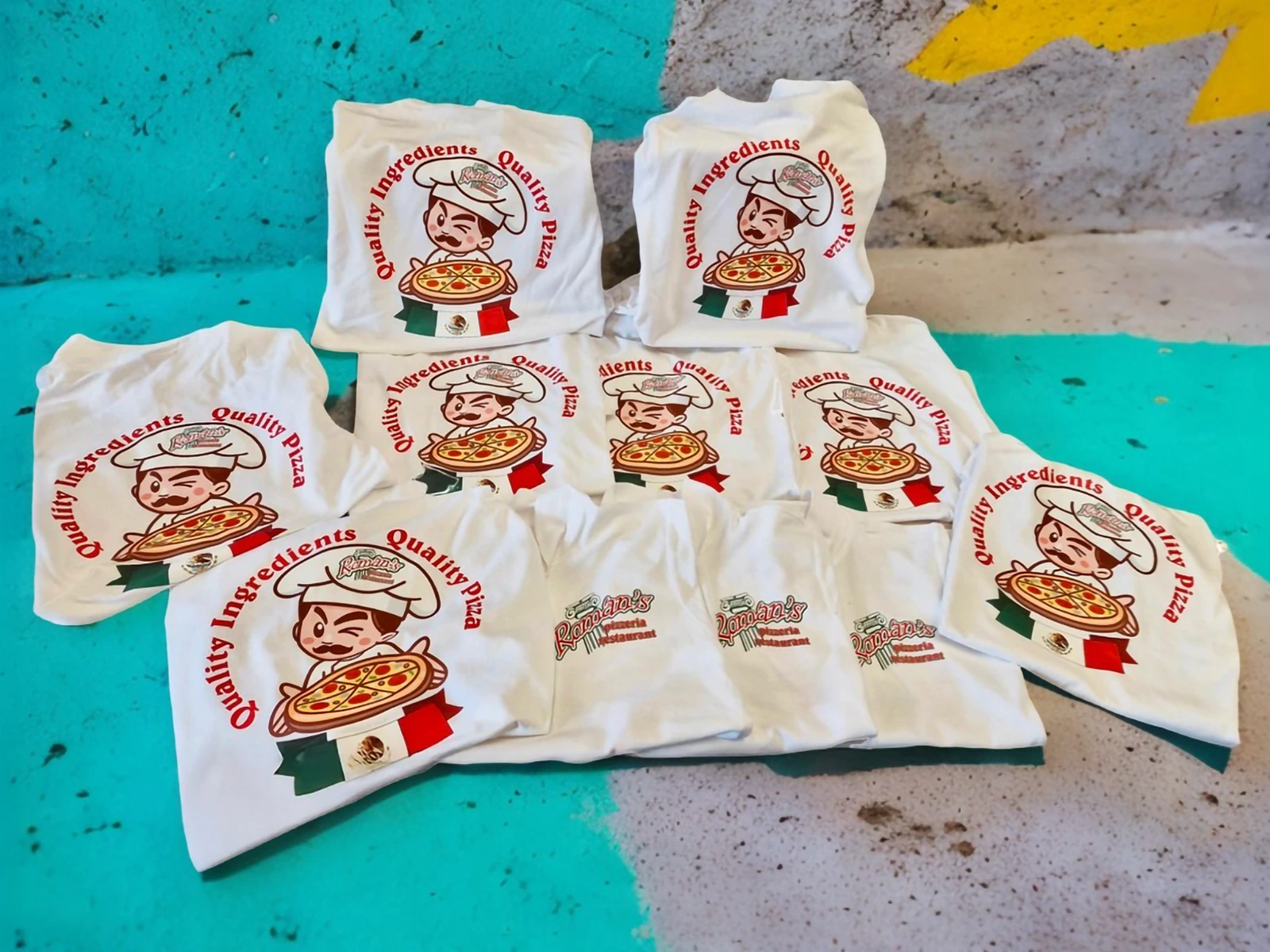 White shirts with restaurant logo transfers